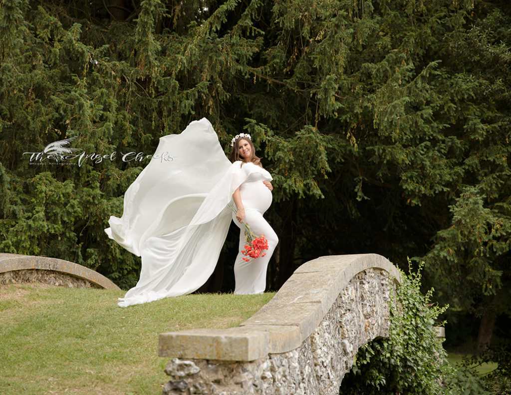 Profession Maternity Photographer, Pregnant lady standing on a bridge