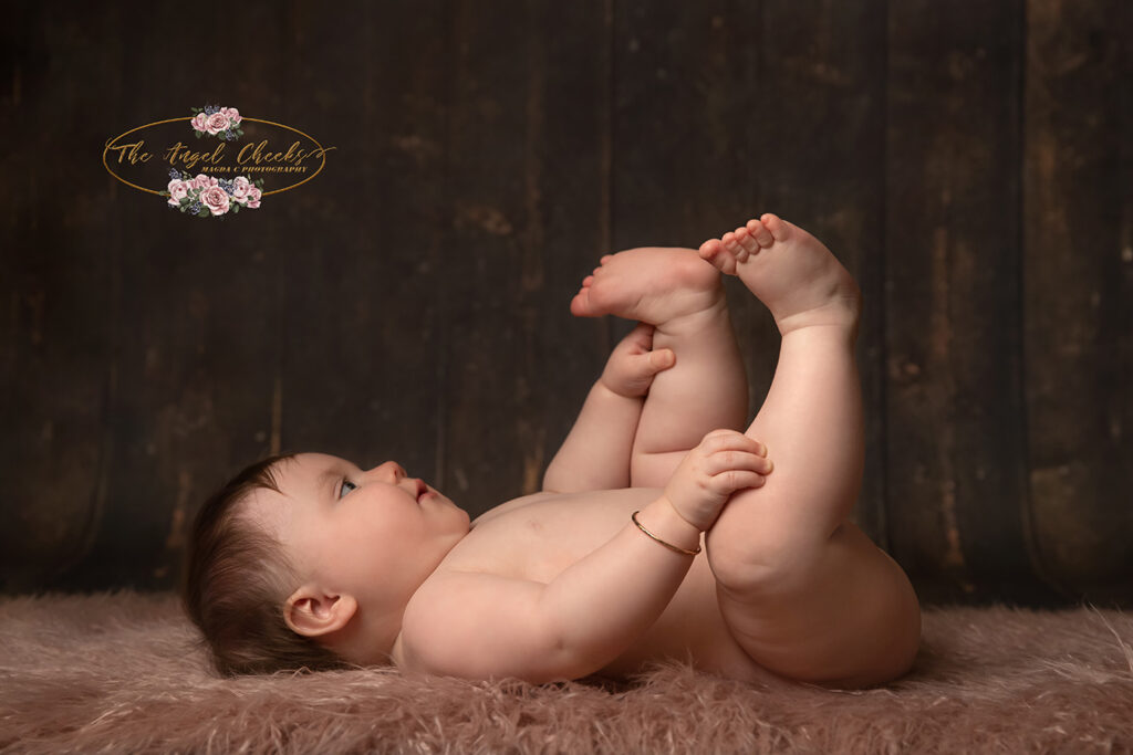 sitting baby playing